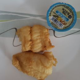 Fish pieces a bit bigger than a 1.5ozcup of tarter sauce!