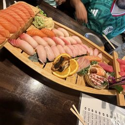 Salmon, Red Snapper, Yellowtail, Tuna nigiri and sashimi Salmon, Red Snapper, Yellowtail, Tuna nigiri and sashimi