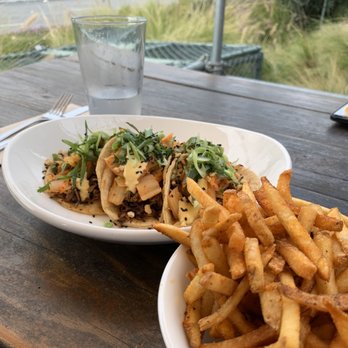 Seabirds Kitchen - Kimchi Tacos and French Fries on outside picnic table - Vegan Near Me - Costa Mesa, California
