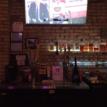 Draft Bar - a television and a brick wall - Sports Bars Near Me - Chicago, Illinois