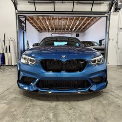 Elite Auto Spa - M2 in for paint protection film and carbon fiber lip installation. Ask about our custom services today.