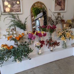 a display of flowers and candles a display of flowers and candles