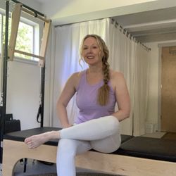 Virta Pilates - Virta Pilates owner Beth Marquis on Tower equipment.