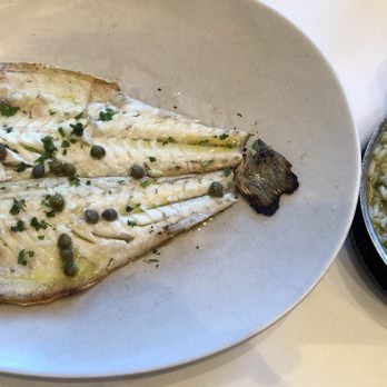 Lefkes - Lavraki fish with spinach rice. - Mediterranean Near Me - Englewood Cliffs, New Jersey