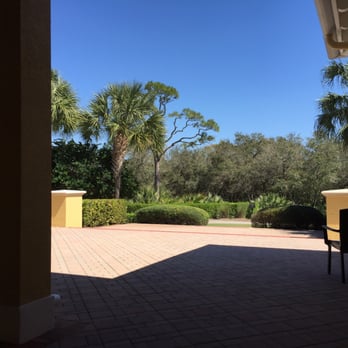 Braxton's - a patio with a table and chairs - New American Near Me - Bonita Springs, Florida Braxton's - a patio with a table and chairs - New American Near Me - Bonita Springs, Florida