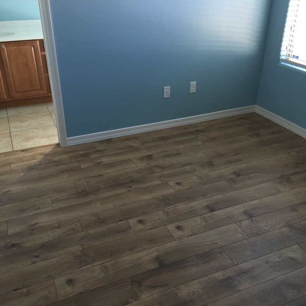 Complete Flooring Tucson - Complete Flooring's Century Oak laminate in a guest bedroom, replacing the old carpet in there. - Flooring Near Me - Tucson, Arizona Complete Flooring Tucson - Complete Flooring's Century Oak laminate in a guest bedroom, replacing the old carpet in there. - Flooring Near Me - Tucson, Arizona