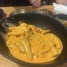 Rose Tteokbokki -- Delicious !!!! Bacon bits in there too :) Rose Tteokbokki -- Delicious !!!! Bacon bits in there too :)