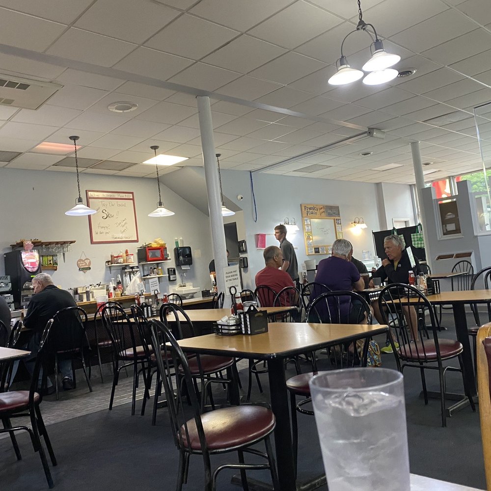 a restaurant with tables and chairs a restaurant with tables and chairs