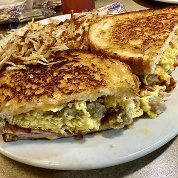 Denny's - Grand Slamwich - A breakfast sandwich with scrambled eggs, ham, and cheese on toasted bread, served with hash browns at Denny's. - Diners Near Me - Willowbrook, Illinois