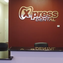 Xpress Dental - Front Desk and Reception area with polished sign and countertops