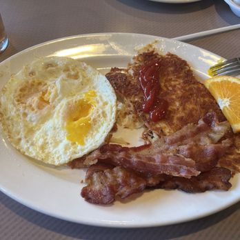 Spires Restaurant - Two eggs over medium, well-done hashbrowns, and bacon, - Breakfast & Brunch Near Me - Tustin, California