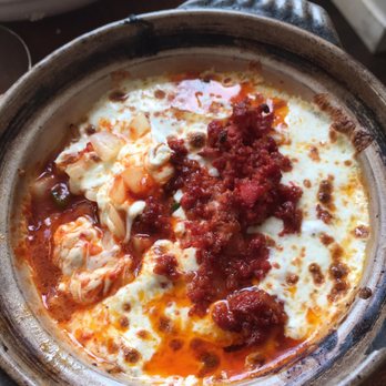 Haenyeo - Fundido - Spicy rice cake w/melted cheese and sprinkled w/chorizo - a must for the table. Saucy and Spicy Rice Cake Fundido - Korean Near Me - Brooklyn, New York