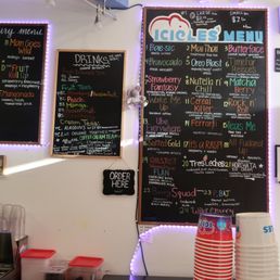 a menu on the wall of a restaurant