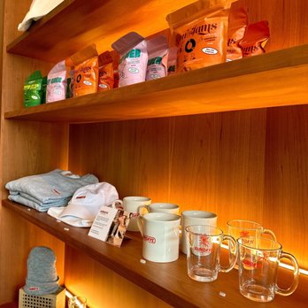 JunePlum by Patois - a shelf of tea and coffee cups - Restaurants Near Me - Toronto, Ontario