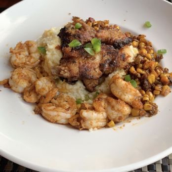 Bold American Fare - Red Neck surf and Turf - maple pork belly, blackened shrimp, jalapeño grits, and corn salsa - Steakhouses Near Me - Algonquin, Illinois Bold American Fare - Red Neck surf and Turf - maple pork belly, blackened shrimp, jalapeño grits, and corn salsa - Steakhouses Near Me - Algonquin, Illinois