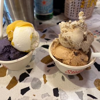 Stella Jean's Ice Cream - Ube & Pandesal Toffee and Mango Sticky Rice (Left), Apple & Butter Crumble and Salted Maple & Banana Bread (Right) - Ice Cream & Frozen Yogurt Near Me - Costa Mesa, California Stella Jean's Ice Cream - Ube & Pandesal Toffee and Mango Sticky Rice (Left), Apple & Butter Crumble and Salted Maple & Banana Bread (Right) - Ice Cream & Frozen Yogurt Near Me - Costa Mesa, California