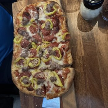 Giuseppe's Bar & Grille - Rustic Flatbread pizza with pepperoni, sausage, and peppers - Italian Near Me - Henderson, Nevada