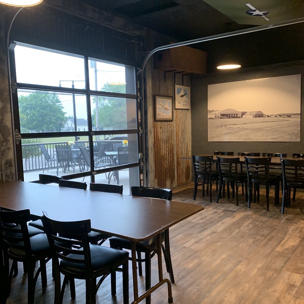 Henry's Steakhouse - Dining area with garage door to deck - Steakhouses Near Me - Kingsford, Michigan Henry's Steakhouse - Dining area with garage door to deck - Steakhouses Near Me - Kingsford, Michigan