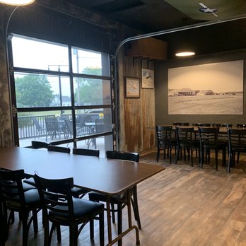 Henry's Steakhouse - Dining area with garage door to deck - Steakhouses Near Me - Kingsford, Michigan Henry's Steakhouse - Dining area with garage door to deck - Steakhouses Near Me - Kingsford, Michigan