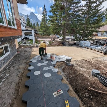 Azuro Outdoor Design And Construction - a man working on a patio - Landscaping Near Me - Canmore, Alberta Azuro Outdoor Design And Construction - a man working on a patio - Landscaping Near Me - Canmore, Alberta