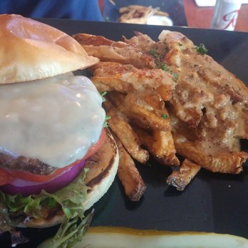 The Angry Beaver - Classic burger w/ Jack cheese, and Poutine w/ country gravy. Delicious, juicy, flavorful. - Sports Bars Near Me - Seattle, Washington The Angry Beaver - Classic burger w/ Jack cheese, and Poutine w/ country gravy. Delicious, juicy, flavorful. - Sports Bars Near Me - Seattle, Washington