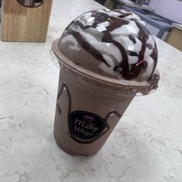 a chocolate milkshake with whipped cream on top a chocolate milkshake with whipped cream on top