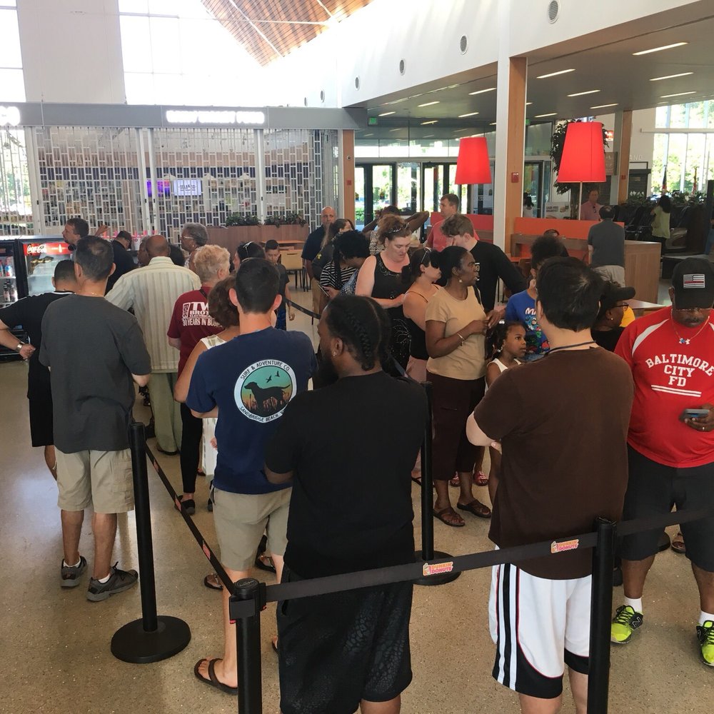 Dunkin' -  a line of people waiting in line at a dunkin donuts store - Coffee & Tea Near Me - Aberdeen, Maryland