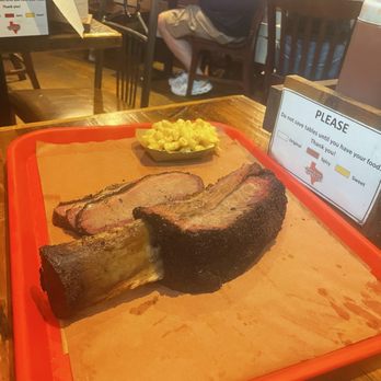 Terry Black's Barbecue - The Dino rib! (Guy next to me ordered this, a real $$$ treat!) - Barbeque Near Me - Austin, Texas Terry Black's Barbecue - The Dino rib! (Guy next to me ordered this, a real $$$ treat!) - Barbeque Near Me - Austin, Texas