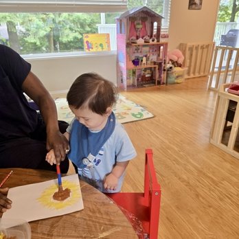 Safe Garden Multi Age Home - Little artists creating beautiful sunflower paintings at SafeGarden Daycare. - Child Care & Day Care Near Me Safe Garden Multi Age Home - Little artists creating beautiful sunflower paintings at SafeGarden Daycare. - Child Care & Day Care Near Me