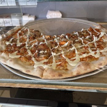 Rock City Pizza - Randolph - a pizza with meat and cheese - Pizza Near Me - Randolph, Massachusetts