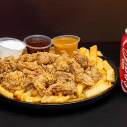 Thang's Fish and Chicken - Savory fried liver bites served with golden fries, sauces, and Coca-Cola.
