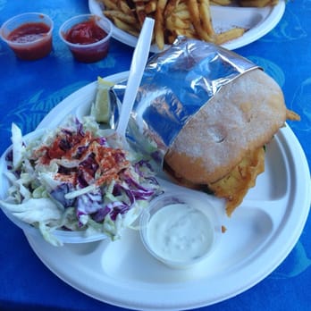 Harbor Fish Cafe - Fish po boy. Fish taco in the background. - Seafood Near Me - Carlsbad, California Harbor Fish Cafe - Fish po boy. Fish taco in the background. - Seafood Near Me - Carlsbad, California