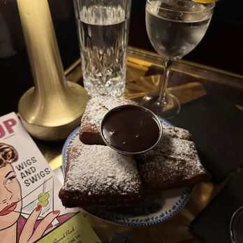 The Wig Shop - beignets ($8): cinnamon banana curd, chocolate - Cocktail Bars Near Me - Boston, Massachusetts The Wig Shop - beignets ($8): cinnamon banana curd, chocolate - Cocktail Bars Near Me - Boston, Massachusetts