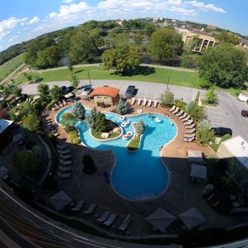 Courtyard by Marriott Pigeon Forge - Wide angle view from balcony on 6th floor of the pool, lazy river, seating, parking lot, and river. - Hotels Near Me - Pigeon Forge, Tennessee Courtyard by Marriott Pigeon Forge - Wide angle view from balcony on 6th floor of the pool, lazy river, seating, parking lot, and river. - Hotels Near Me - Pigeon Forge, Tennessee