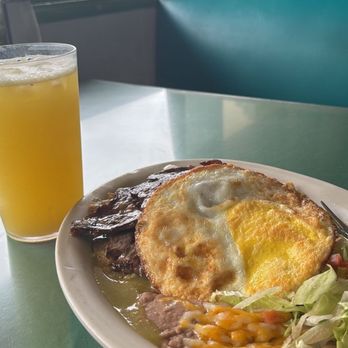 Chico's Restaurant - Chilaquiles with carne asada. Added egg well done.  Agua fresca pineapple with orange. 10/10 - Mexican Near Me - San Marcos, California
