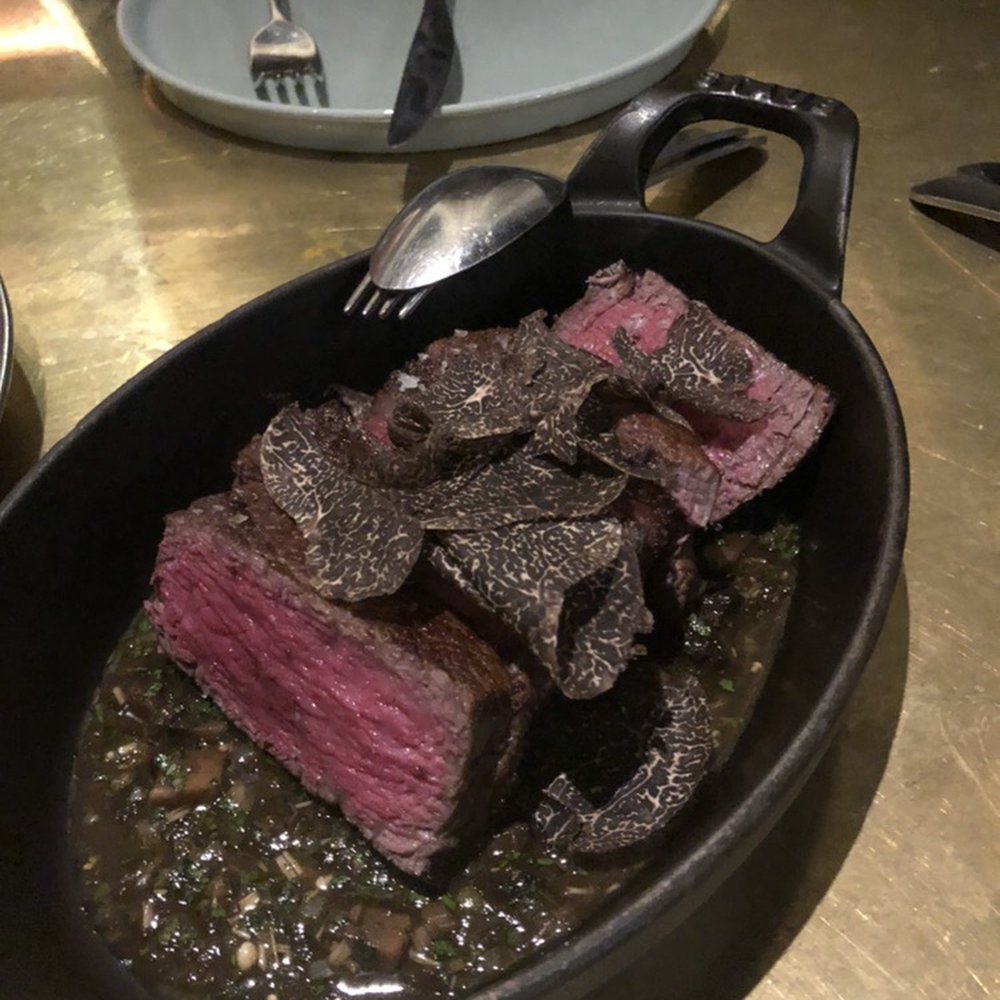 Wonderfully soft and tender beef steak with mushroom and jus, with fresh black truffle shavings. Wonderfully soft and tender beef steak with mushroom and jus, with fresh black truffle shavings.