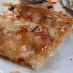 Gluten free pizza dough raw crust burnt. Sloppy and not good at all