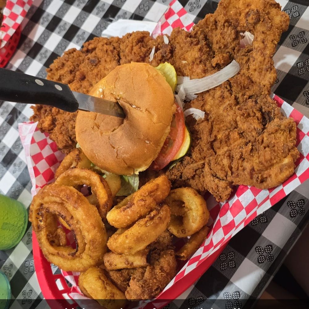 Chubby's Restaurant - Pork tenderloin sandwich with onion rings - Southern Near Me - Sevierville, Tennessee Chubby's Restaurant - Pork tenderloin sandwich with onion rings - Southern Near Me - Sevierville, Tennessee