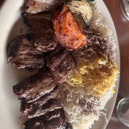 a plate of meat and rice