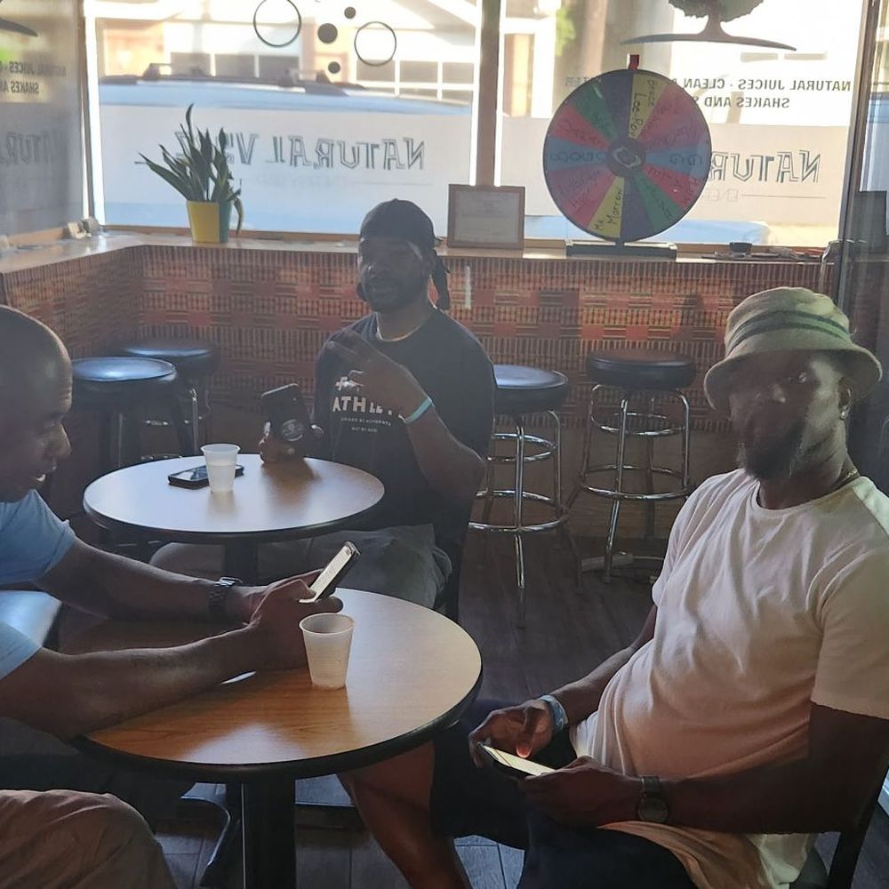 Natural Vybz - a group of men sitting at a table - Juice Bars & Smoothies Near Me - Teaneck, New Jersey Natural Vybz - a group of men sitting at a table - Juice Bars & Smoothies Near Me - Teaneck, New Jersey