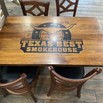 Texas  Best Smokehouse - Tables have the logo emblazoned upon them. - Barbeque Near Me - Italy, Texas