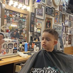 Stay Gold Barber Shop - Checking out his new hairstyle