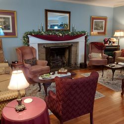 The parlour end of the Great Room is set for visiting, teatime, and more. The other end of the room (not pictured) is used for event space.