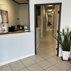Lee Michael H, DDS - Front desk and hallway to treatment stalls