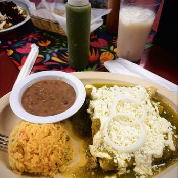 Taquería Doña Raquél - Green enchiladas with rice and beans on the side. - Mexican Near Me - Pompano Beach, Florida Taquería Doña Raquél - Green enchiladas with rice and beans on the side. - Mexican Near Me - Pompano Beach, Florida