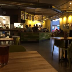 Laughing Planet - kitchen, ordering counter, and the roll-up on the west side of the building