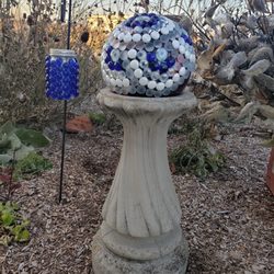 This Becomes That - Repurposed bowling ball garden art and hanging solar light make a great addition to any garden.