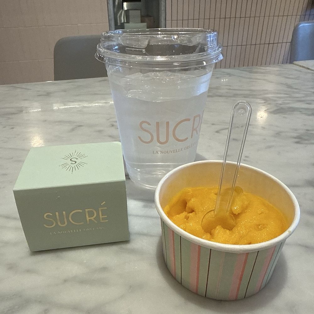 Sucré - Mango sorbet, water, macaron 2 piece box - Desserts Near Me - New Orleans, Louisiana Sucré - Mango sorbet, water, macaron 2 piece box - Desserts Near Me - New Orleans, Louisiana