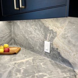 Perfect alignment of slab veining and movement from countertop to backsplash