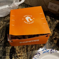 Popeyes Louisiana Kitchen - Box completely torn open with mostly wings inside